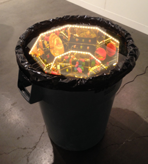 Ajay Kurian, Hive (Want), trash can, plexi, fake pearls, rose lenses, wood, custom M&Ms, reindeer moss, LED lights, copper wire, plastic.